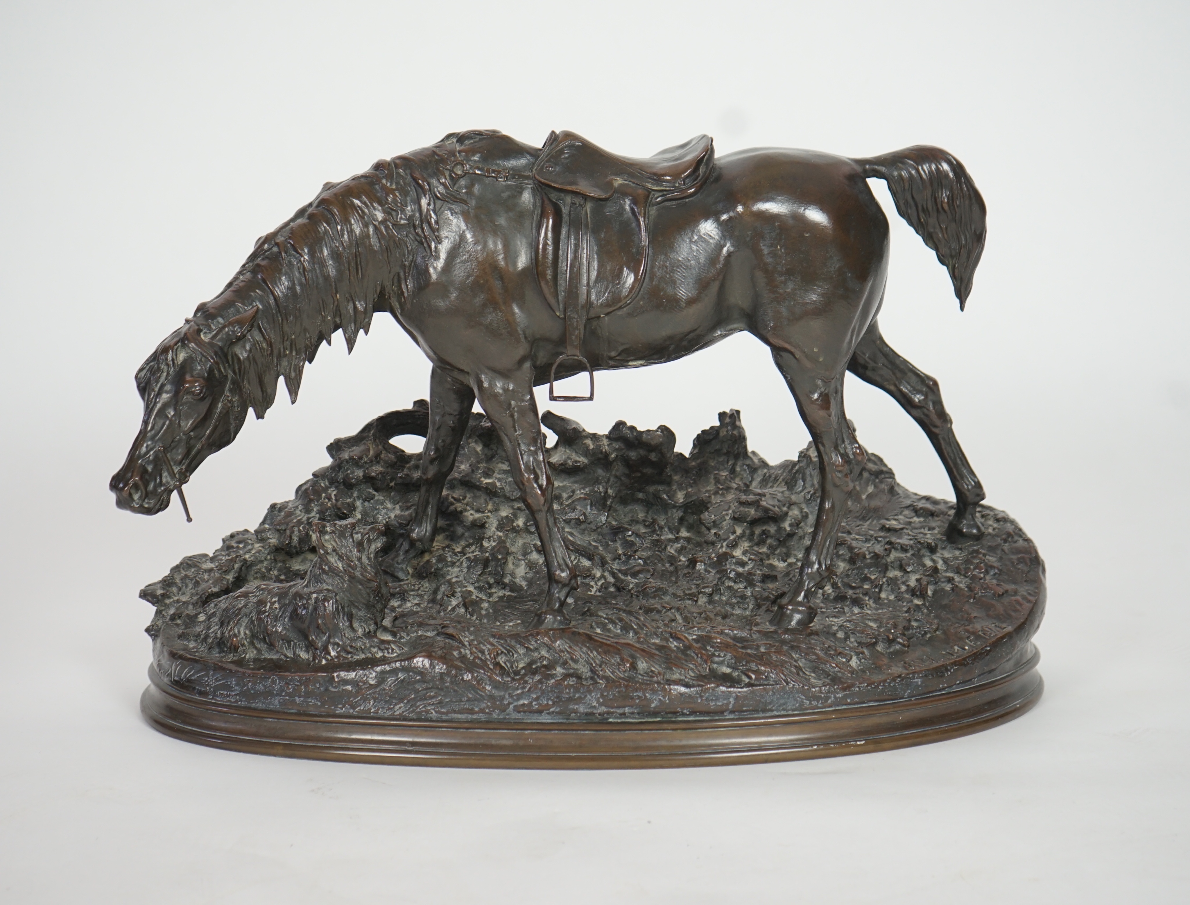 Pierre Jules Mène (French, 1810-1879). A bronze group of a saddled horse standing upon a mound with a terrier at its feet, width 69cm, height 43cm
